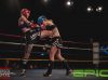 Madelaine Duiker kneeing Jess Seery at Epic 15 by Brock Doe Fight Photography