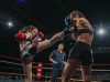 Nicola Callander kicking Kerrianne McKay at Epic 15 by Emanuel Rudnicki Fight Photography