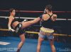 Dina Sokol kicking Abby Nelson at Epic 9 by Emanuel Rudnicki Fight Photography
