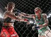 Megan Anderson punching Amanda Bell at Invicta FC 17 by Esther Lin