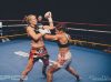 Patricia Silva punching Caley Reece at Epic 9 by Emanuel Rudnicki Fight Photography