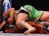 Raquel Pennington choking Ashlee Evans-Smith at UFC 181