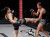 Sijara Eubanks kicking Gina Begley at Invicta 12 by Scott Hirano