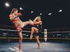 Stephanie Glew at Epic 13 kicking Gemma Pike by Emanuel Rudnicki Fight Photography