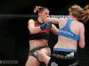 Tonya Evinger punching Colleen Schneider at Invicta FC 17 by Esther Lin