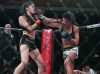 Alyse Anderson punching Shino VanHoose at Invicta FC 25 by Scott Hirano