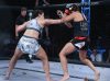 Amy Coleman punching Felicia Spencer at Invicta FC 24 by Scott Hirano