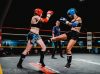 Jo Sutton kicking Mandy Hopper at Epic 16 by Emanuel Rudnicki Fight Photography