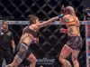 Mara Borella punching Suvi Salmimies by Iikka Nikkinen for MMA Viking