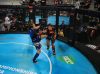 Michele Oliveira punching Alexandra Kovacs at 2017 IMMAF Worlds by Jorden Curran Photography