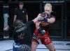 Pam Sorenson punching Helena Kolesnyk at Invicta FC 24 by Scott Hirano