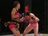 Pearl Gonzalez punching Kali Robbins at Invicta FC 28 by Dave Mandel