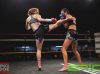 Shannon Peek kicking Kerrianne McKay at Epic 17 by Brock Doe Fight Photography