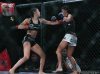 Shino VanHoose punching Alyse Anderson at Invicta FC 25 by Scott Hirano