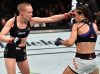 Rose Namajunas punching Joanna Jedrzejczyk at UFC 223 from UFC Facebook