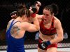 Alexis Davis punching Sara McMann at The Ultimate Fighter 24 Finale from UFC Facebook