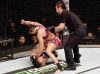 Amanda Nunes punching Shayna Baszler at UFC Fight Night 62 from UFC Facebook
