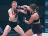 Christina Ricker punching Caitlin Sammons at Invicta FC 34 by Dave Mandel