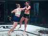 Courtney King punching Holli Logan at Invicta FC 34 by Dave Mandel