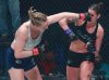 Courtney King punching Holli Logan at Invicta FC 34 by Dave Mandel