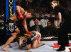 Cristiane Justino punching Jan Finney at Strikeforce June 26th 2010 by Esther Lin