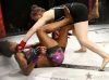 Erin Blanchfield punching Brittney Cloudy at Invicta FC 30 by Dave Mandel