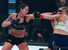 Holli Logan punching Courtney King at Invicta FC 34 by Dave Mandel