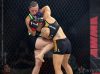 Jillian DeCoursey kneeing Alesha Zappitella at Invicta FC 30 by Dave Mandel