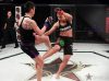 Kaitlin Young kicking Sarah Patterson at Invicta FC 32 by Dave Mandel