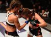 Karolina Kowalkiewicz punching Rose Namajunas at UFC 201 from UFC Facebook