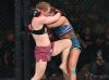 Kay Hansen kneeing Sharon Jacobson at Invicta FC 33 by Dave Mandel