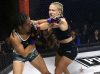 Kelly D'Angelo punching Lindsey VanZandt at Invicta FC 31 by Dave Mandel