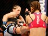 Liz Carmouche kicking Miesha Tate at UFC on Fox 11 from UFC Facebook