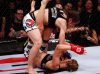 Liz Carmouche punching Marloes Coenen at Strikeforce 3-5-11 by Esther Lin