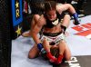 Liz Carmouche punching Marloes Coenen at Strikeforce 3-5-11 by Esther Lin