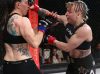 Liz Tracy punching Cheri Muraski at Invicta FC 29 by Dave Mandel