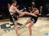 Maria Buzaglo kicking Corina Herrera at Combate Americas 29