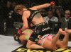 Marloes Coenen punching Miesha Tate at Strikeforce 7-30-11 by Josh Hedges