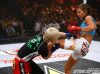 Miesha Tate kicking Maiju Kujala at Strikeforce Challengers 10 by Esther Lin
