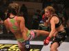 Miesha Tate kicking Marloes Coenen at Strikeforce 7-30-11 by Josh Hedges