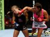 Miesha Tate punching Julie Kedzie at Strikeforce 8-18-2012 by Esther Lin