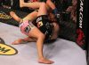 Miesha Tate punching Marloes Coenen at Strikeforce 7-30-11 by Josh Hedges