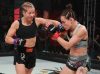 Minna Grusander punching Jinh Yu Frey at Invicta FC 33 by Dave Mandel