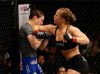 Ronda Rousey elbowing Sara McMann at UFC 170 from UFC Facebook