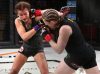 Sarah Kaufman punching Katharina Lehner at Invicta FC 29 by Dave Mandel