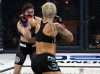 Shanna Young punching Lisa Spangler at Invicta FC 31 by Dave Mandel