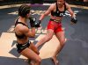 Yajaira Romo kicking Vanesa Rico at Combate Americas 23
